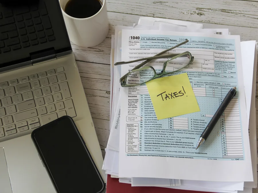 Self-employed borrower reviewing bank statements for mortgage