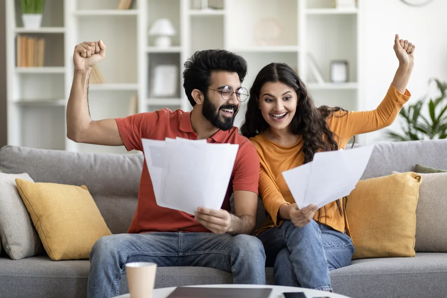 Couple celebrating after getting DU Approval on their mortgage in Florida