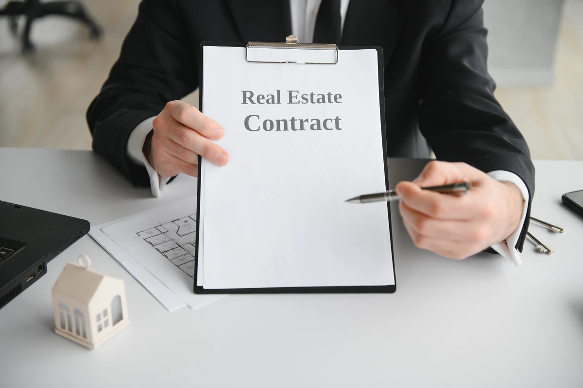 Florida homebuyer handing over an earnest money deposit check for a home purchase