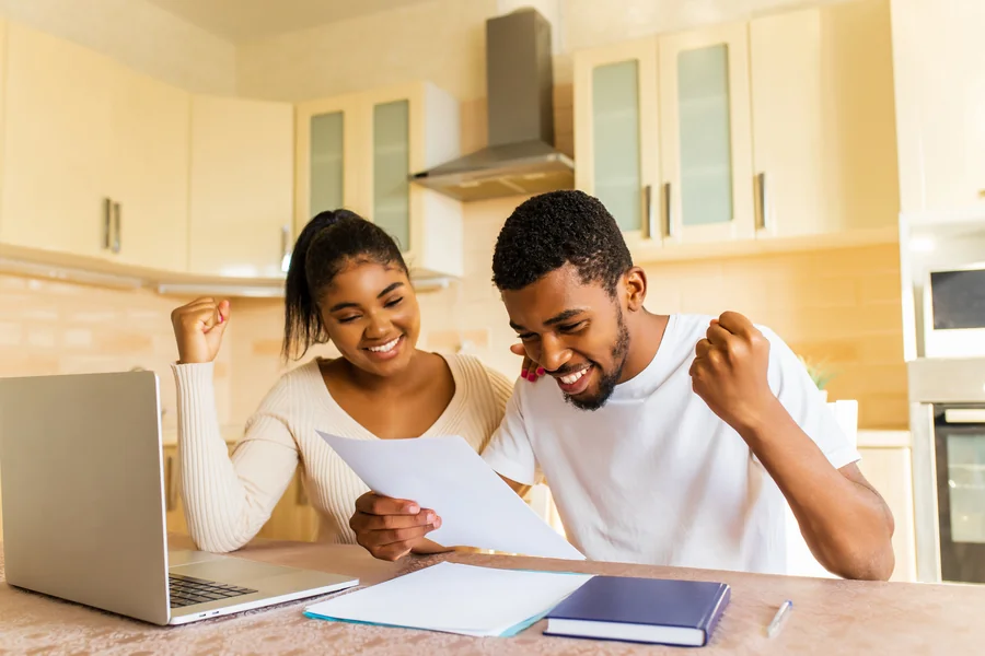 Florida homeowner reviewing FHA refinance documents with a mortgage broker