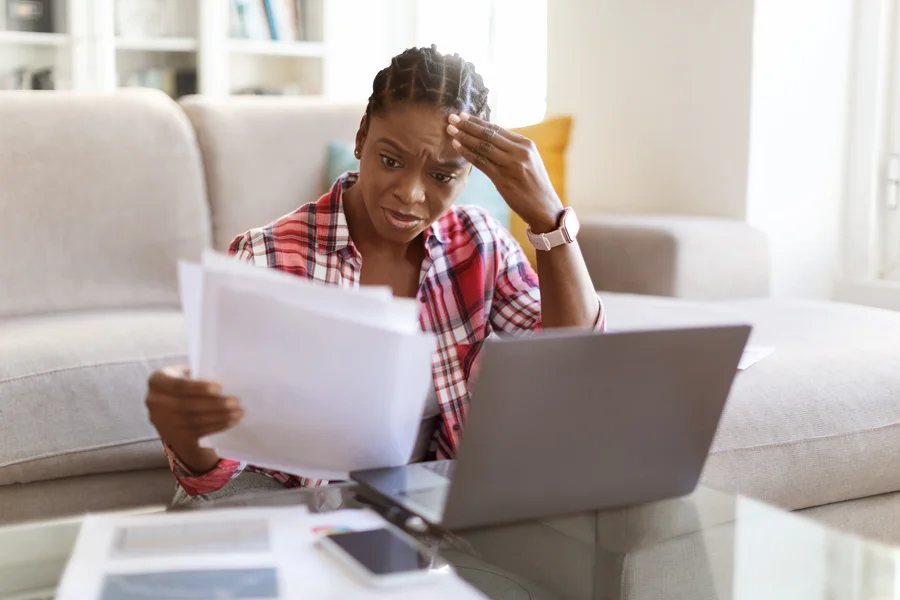 Self-employed homeowner reviewing tax documents and mortgage paperwork