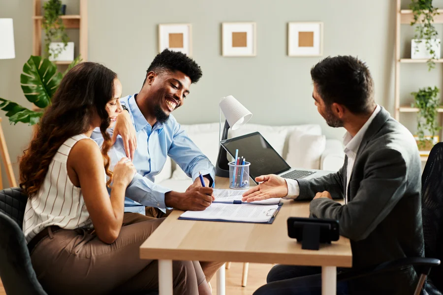 First-time homebuyer with no credit score reviewing mortgage options with a loan officer