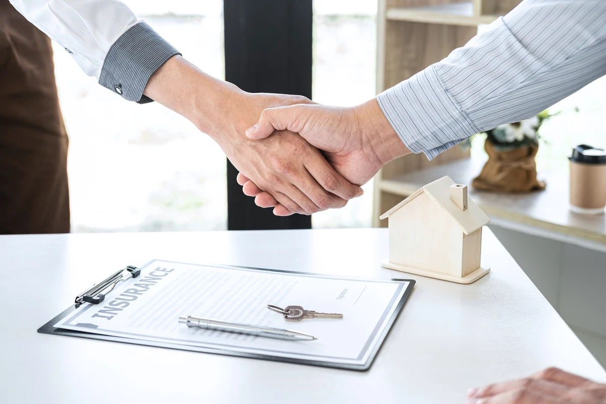 Florida homebuyers reviewing closing costs on a Loan Estimate with their mortgage broker