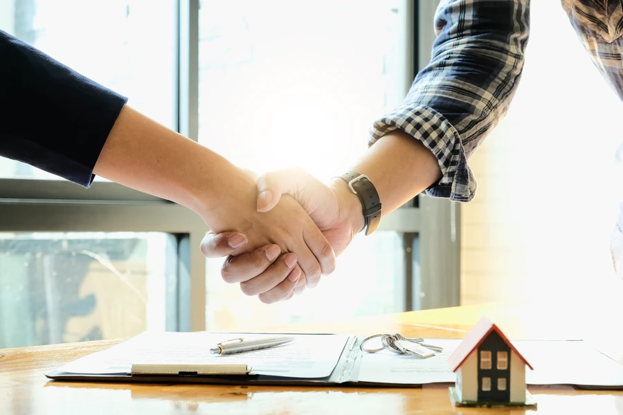 Homebuyer celebrating fast mortgage approval with keys in hand