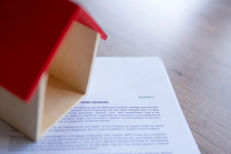 Couple reviewing mortgage documents during divorce proceedings