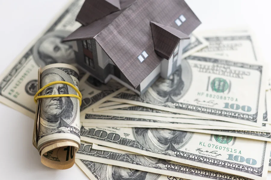 Homeowner calculating ways to save money on mortgage interest over time