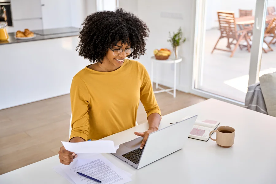 Florida homeowner reviewing home equity loan options on laptop at home