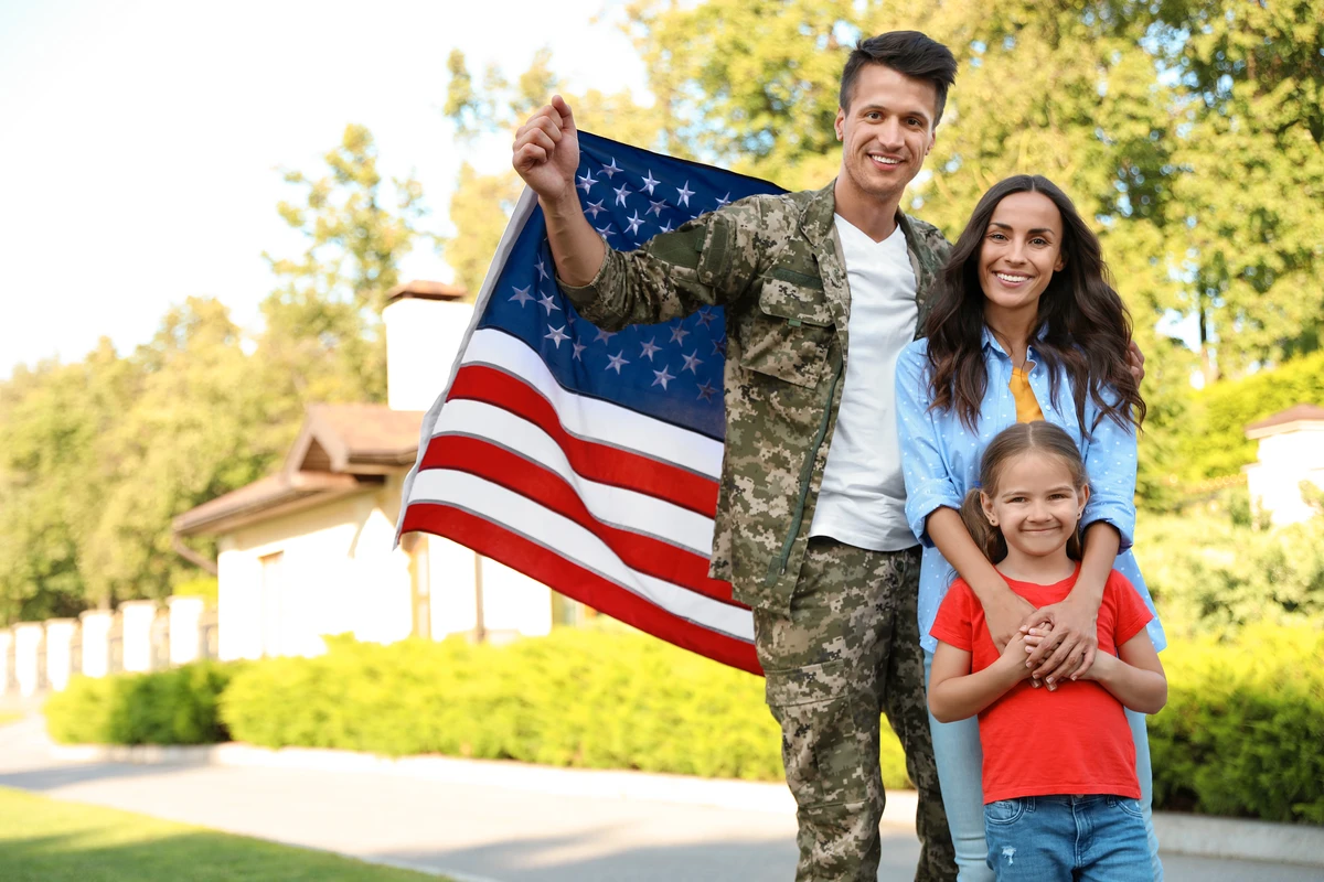 Florida veteran homeowners reviewing a VA streamline refinance, the IRRRL, at their kitchen table